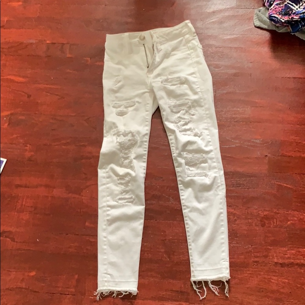 Distressed white jeans